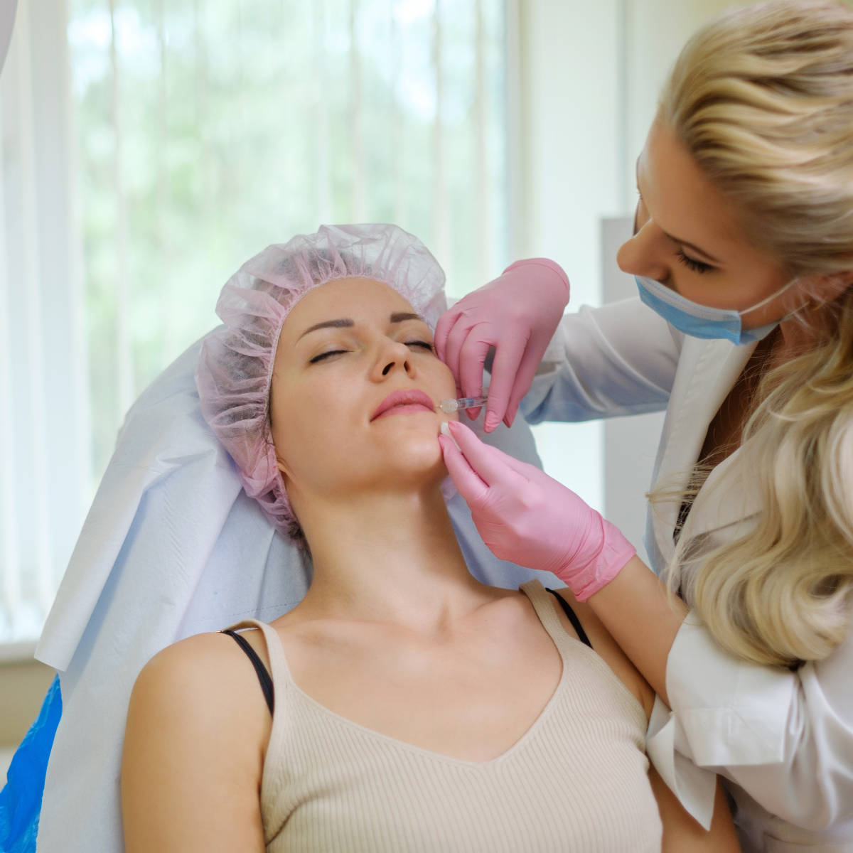 Woman getting treatment with injectable hyaluronic acid dermal filler
