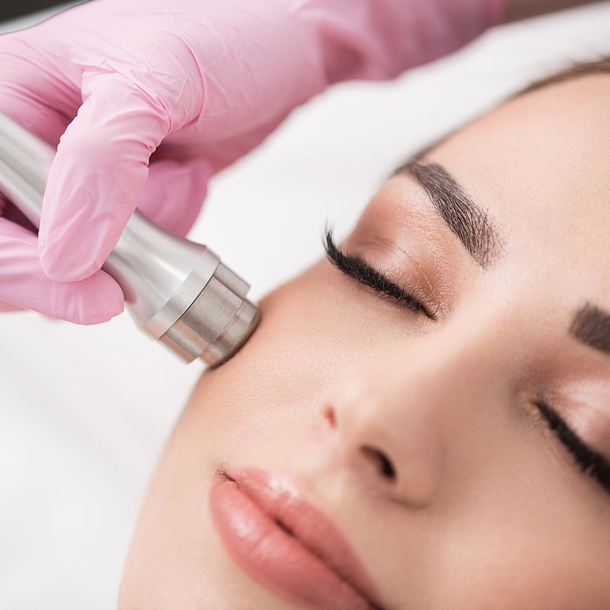 Woman getting treatment with injectable hyaluronic acid dermal filler